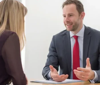 Can I sublet my commercial space — commercial tenant reviewing sublease agreement with solicitor at office desk