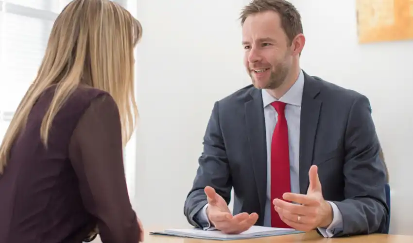 Can I sublet my commercial space — commercial tenant reviewing sublease agreement with solicitor at office desk