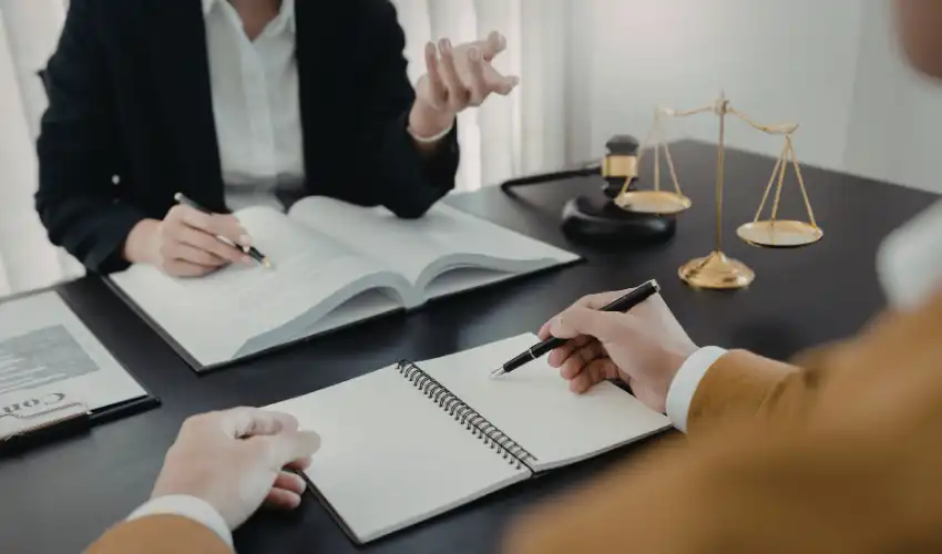 Types of commercial leases UK — solicitor explaining different commercial lease agreement options to business owner at desk