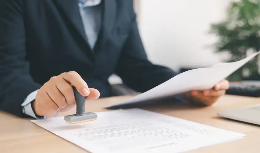 Solicitor and client reviewing heads of terms document before signing a commercial lease